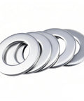Five clutch spacers for 3/4 inch shafts, compatible with Predator 212cc engines, in a fan arrangement. Clutch Spacer Shim Washer Kit for Mini Bikes.