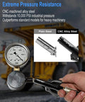 Person using Heavy Duty Grease Gun Coupler With Leakproof Quick Lock Release, 10,000 PSI, CNC alloy steel, with industrial machinery in background.