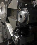Set Of 5 14mm Brass Ball CNC Nozzles With 4mm Slanted Hole Screw Lock High Pressure Coolant Nozzles in a CNC lathe setup.