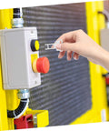 Hand inserting CNC Mill Safety Actuating Key For Industrial Door Locking And Machine Mechanism into light switch panel.