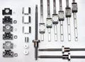 Components of 8x4 Ft. CNC Router Kit Rail Guide System w/16-20mm Rails & Ball Screws arranged on white surface.