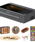 Front view of 55W CO2 Laser Cutter And Engraver Desktop Machine with engraved wood, leather, and glass samples