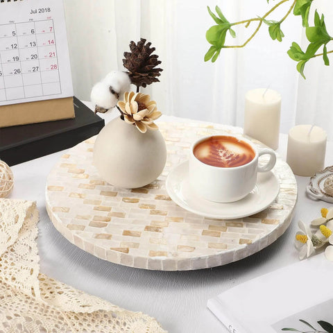 12 inch mother of pearl lazy susan turntable with marble pattern, used for serving coffee on a decorative wooden tray.