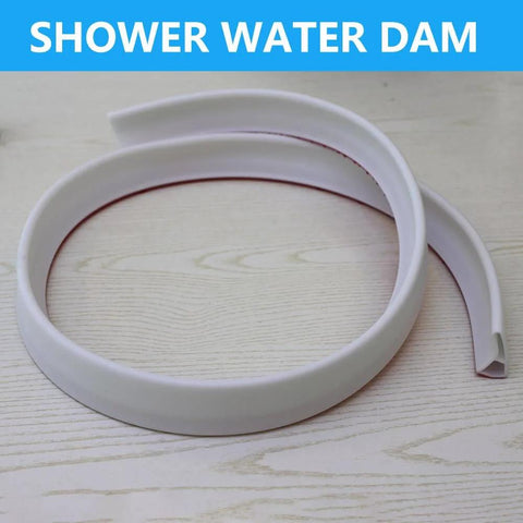 Collapsible Shower Threshold Water Dam, 39 In, Self Adhesive Shower Edge Water Barrier Stopper on wood surface