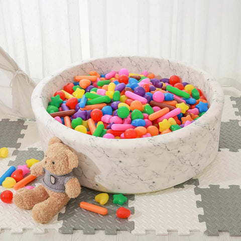 Ball Pit Balls for Kids -Pack of 150 Colorful Ball Pit Balls Crush Proof Plastic Toy Balls in a toddler play area with teddy bear