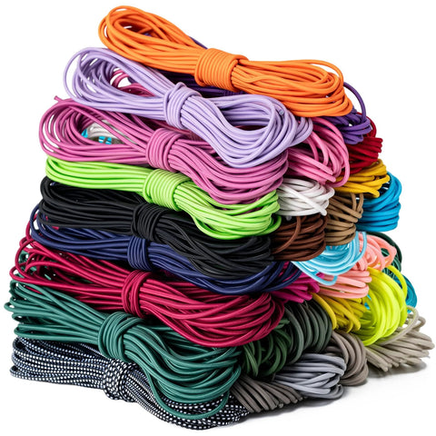 Stack of colorful heavy duty elastic bungee cords in various sizes for kayaks, tarps, canopies, camping, and DIY projects.