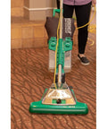 Commercial Upright Vacuum With ProCup Comfort Grip, 870W Motor, 16-Inch Cleaning Path, Easy-Empty Dirt Cup, And Magnet Bar in use