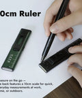 Person using compact 10cm ruler with integrated pen for quick measurements on paper, suitable for work or home use.