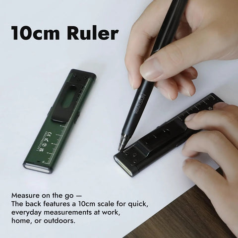 Person using compact 10cm ruler with integrated pen for quick measurements on paper, suitable for work or home use.