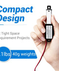 Hand holding 12V Micro Linear Actuator With 1.2 Inch Stroke 64N 14.4Lb Lift 0.6 Inch Per Second Speed IP54 Waterproof DC Actuator