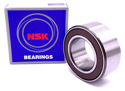 Compact angular contact double row bearing 30BD40, 30x55x23 mm, sealed and Japan-made, with blue NSK box in background.