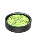 Compact Bulls Eye Bubble Level For RVs And Boats 1.3 Inch Circular Acrylic Level Pocket Friendly High Precision Leveler For Trailers Campers And Vehicles Great For Tight Spaces And Accurate Orientation In Any Outdoor Setup, visible from a side angle, showcasing its circular design and markings.