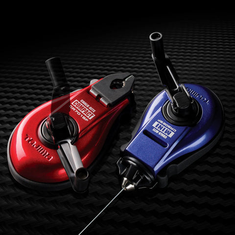 Red and blue Compact Chalk Line Marker with Extra Bold 1.0mm Line, Durable Aluminum Case, Collapsible Handle on black surface