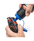 Hands filling Compact 50 ft chalk reel with blue chalk for fast, precise straight line marks in construction, drywall, and carpentry