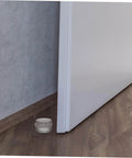 Close-up of a door with the Six Piece Door Silencer And Stopper Sliding Buffer Set for noiseless closing and finger safety on a wooden floor.