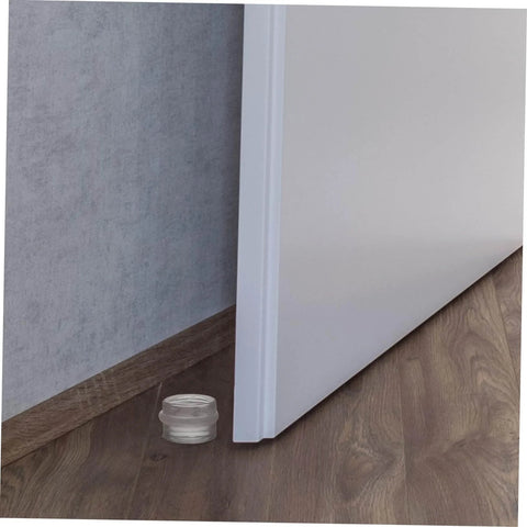 Close-up of a door with the Six Piece Door Silencer And Stopper Sliding Buffer Set for noiseless closing and finger safety on a wooden floor.