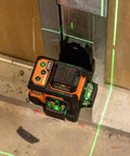 Compact self-leveling laser level with bright green cross lines and 360-degree planes delivers precise alignment for construction and carpentry, up to 100 ft range, magnetic mount, rechargeable, class 2 safety installed on metal surface
