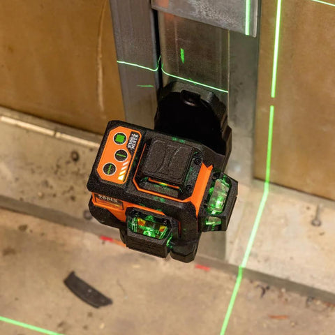 Compact self-leveling laser level with bright green cross lines and 360-degree planes delivers precise alignment for construction and carpentry, up to 100 ft range, magnetic mount, rechargeable, class 2 safety installed on metal surface