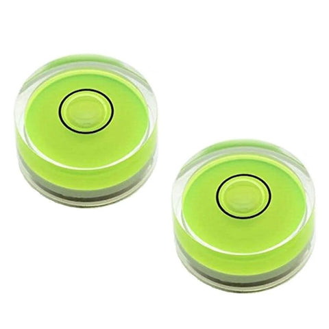 Two compact green round mini spirit levels with clear acrylic housings for precise bubble readings and alignment in tiny projects.