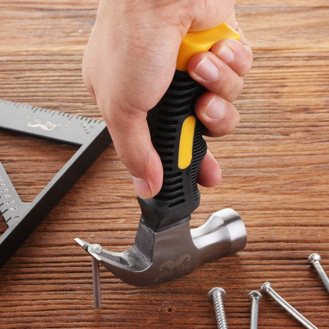 Compact 8oz magnetic claw nail hammer with an ergonomic non-slip handle and rust-resistant, high-density carbon steel in hand.