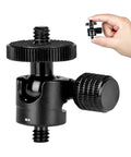 Compact Mini Ball Head Tripod Mount With One Quarter Inch Screw Connector For Cameras And DSLRs shown with hand for scale