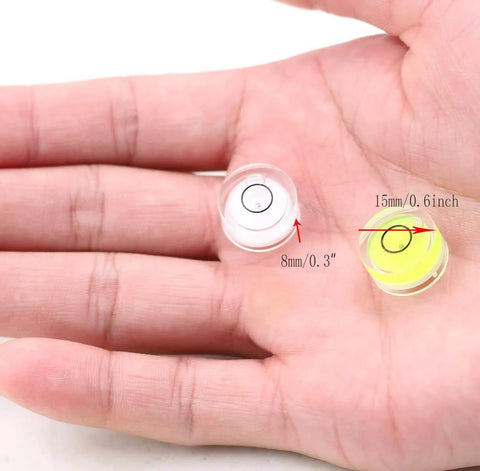 Compact plastic circular bubble level delivers quick, accurate leveling for RVs, shown in hand highlighting size in millimeters.