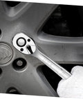 Compact Quick Release Ratchet Wrench With Portable Socket Spanner for Auto Repair in use on car wheel
