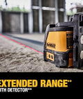 Image of a compact self leveling red cross line laser with a 165 ft range using a detector on a construction site.