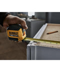 Atomic Compact 30 Ft Tape Measure With Finger Brake For Precision And One Hand Quick Measurement in use on job site