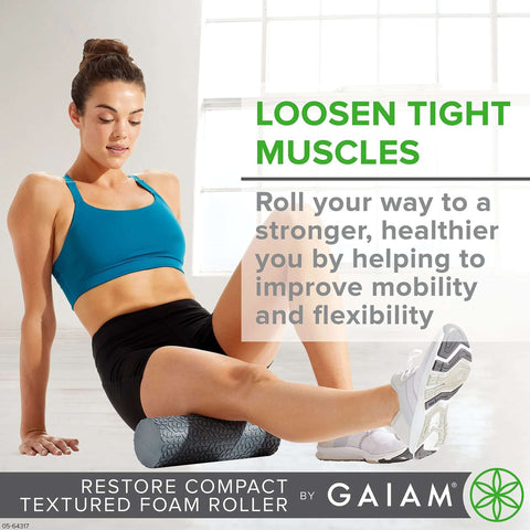 Woman using compact textured foam roller for muscle recovery and massage, 12 inch length, 4 inch diameter, in yoga workout.
