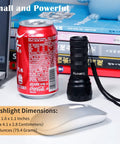 High power compact UV flashlight with 21 LEDs at 395 nm next to a soda can and computer mouse for size comparison.