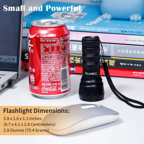 High power compact UV flashlight with 21 LEDs at 395 nm next to a soda can and computer mouse for size comparison.