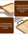 Comparison of a tray with and without the black side mounted tray handle set with two metal pulls for convenience and slip prevention.