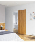 Bedroom with Concealed Sliding Barn Door Hardware Kit With Soft Close, 38 Inch Track, wall-mounted, invisible front track installed.