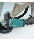 9 Inch Concrete Planer With Dust Extraction Shroud For Durable Surface Finishing, Efficient Material Removal, And Coating Removal, 6600 RPM From A 15 Amp Motor, Powerful Heavy Duty Concrete Surfacing Tool being used on a floor.