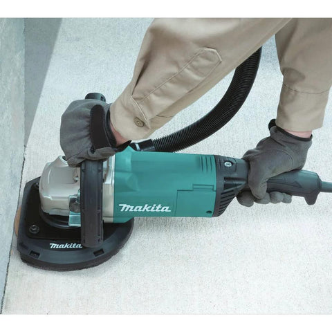9 Inch Concrete Planer With Dust Extraction Shroud For Durable Surface Finishing, Efficient Material Removal, And Coating Removal, 6600 RPM From A 15 Amp Motor, Powerful Heavy Duty Concrete Surfacing Tool being used on a floor.