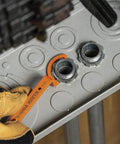 Conduit Locknut Wrench Set With Opposing Offset Bends For Tight Spaces One Half Inch, Three Quarter Inch, And One Inch Sizes Three Piece Magnetic Storage Patent Pending in use on conduit
