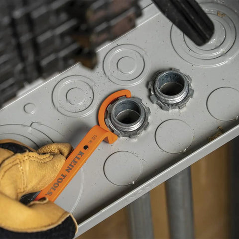 Conduit Locknut Wrench Set With Opposing Offset Bends For Tight Spaces One Half Inch, Three Quarter Inch, And One Inch Sizes Three Piece Magnetic Storage Patent Pending in use on conduit