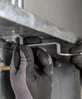 Using Conduit Locknut Wrench Set With Opposing Offset Bends For Tight Spaces One Half Inch, Three Quarter Inch, And One Inch Sizes Three Piece Magnetic Storage Patent Pending to tighten a locknut in a tight space