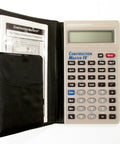Construction Master IV Pocket Size Calculator with manual, displaying numerical keypad and screen, ideal for precise calculations.
