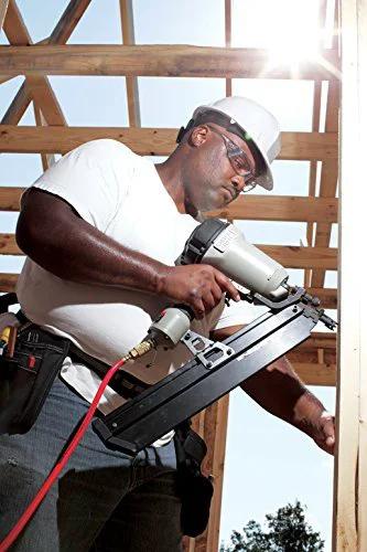 Construction worker wearing Unisex Safety Glasses Shade 3.0 IR Filter Scratch Resistant Black Frame using a nail gun outdoors
