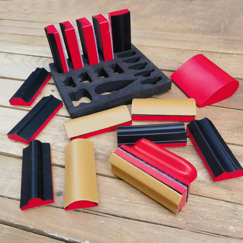16 Piece Contoured Sanding Block Set With Interchangeable Hook And Loop Shapes on wooden surface