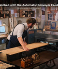 Man using Automatic Conveyor Feeder from Must Have Accessories Set For P2 And P2S Laser Engraver And Cutter