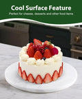 16 inch marble lazy susan turntable organizer made from natural stone, rotating tray featuring a cake with fresh fruit.