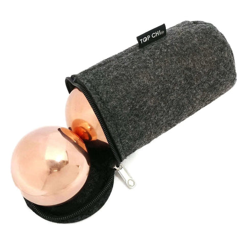 1.5 Inch Solid Copper Baoding Balls with Carry Pouch for Hand Therapy, Exercise, and Stress Relief, displayed partially in a grey pouch