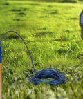 Ultimate 24 Inch Pure Copper Ground Rod Kit With 50 Foot Copper Wire And Alligator Clip in a grassy setting