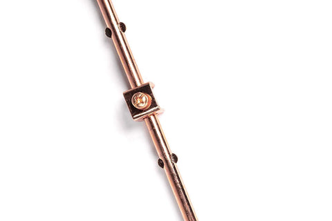 Copper Grounding Rod Four Feet Long Three Eighth Inch Diameter With Attached Ground Rod Clamp on white background.
