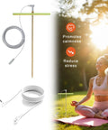 Copper Grounding Rod Kit Pro Grade with wires, clamp, wrench, and T-handle shown beside a person meditating outdoors.
