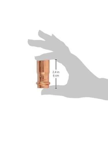 Hand holding Cornat Press Nipple Copper With One Coupling And One Nipple A 28 Mm And 22 Mm Width Durable Copper Plumbing Fitting Component