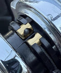 Copper throttle idle cable ferrule for Harley Davidson carburetor throttle cable end joint, installed on motorcycle.